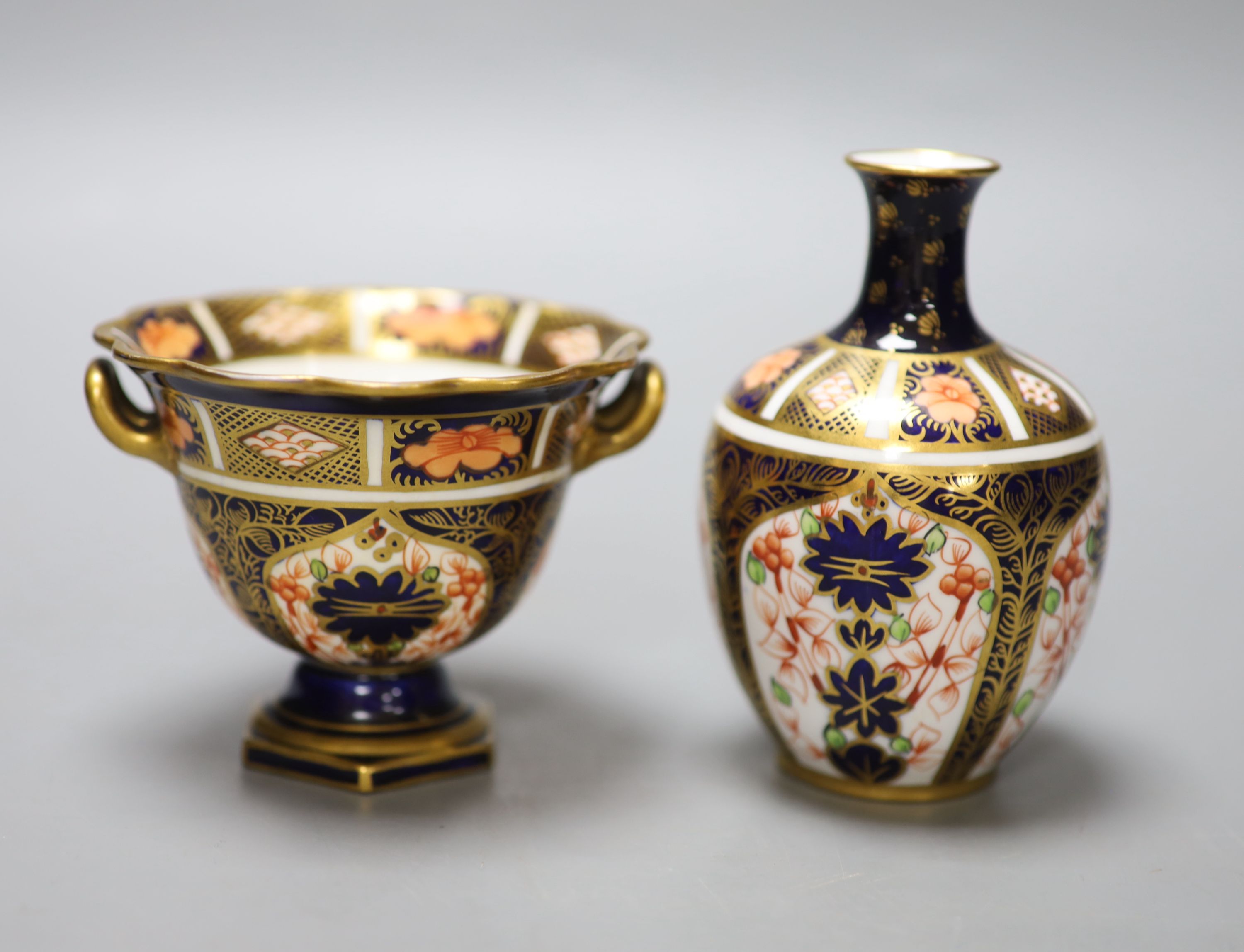 A Royal Crown Derby ovoid vase painted with pattern 1128 and a two handled vase, tallest 11cm